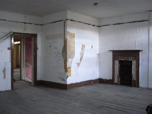 Photo:Top floor room where fireplaces have been removed, September 2009.