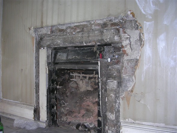 Photo:Missing fireplace.